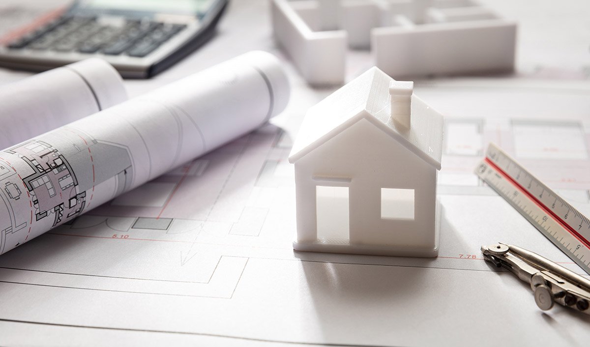 House model and blueprint plans, residential building project architectural design, closeup view
